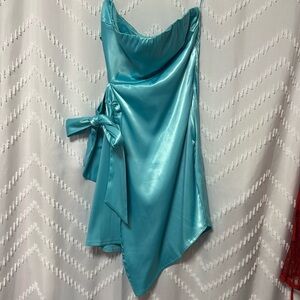 Turquoise, strapped dress! ties on the side, super cute for hoco or semi!